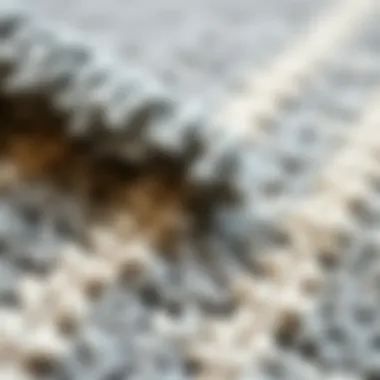 Textural Details of a Vintage Grey Rug Close-up view of the texture of a grey vintage rug