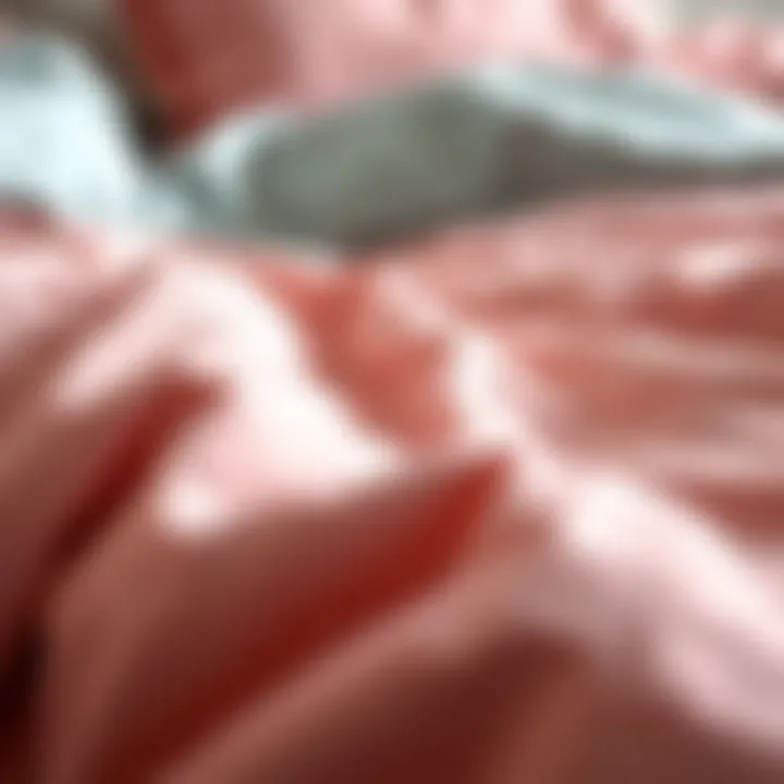 Close-up view of the fabric texture of a pink and grey comforter