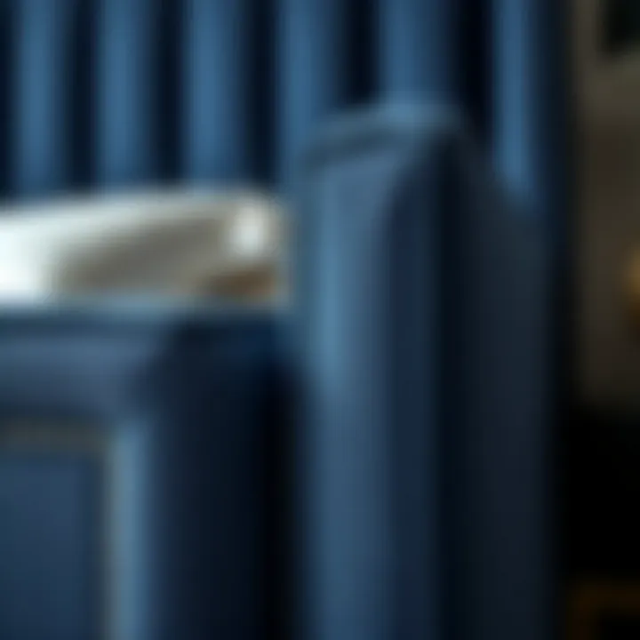 Luxurious Fabric Detail of Navy Blue Upholstered Twin Bed Close-up detail of luxurious fabric and stitching on a twin bed