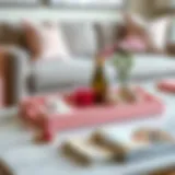 Stylish pink tray on a coffee table with decorative items