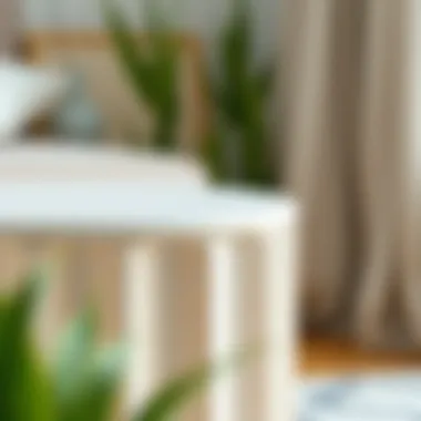 Close-up of a small off-white end table showcasing its textural details